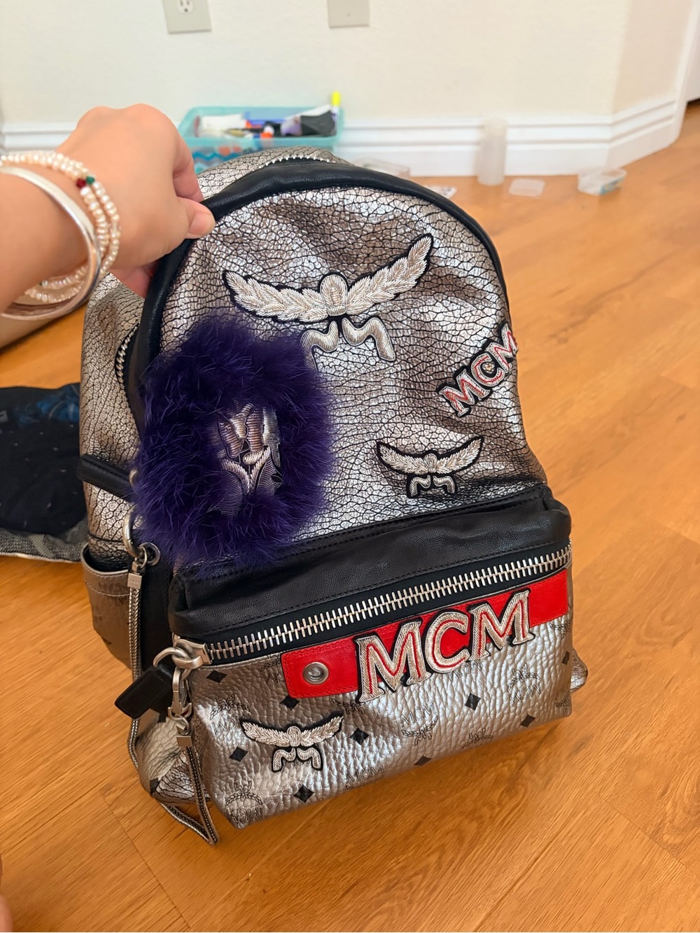 MCM Silver Leather Backpack with Purple Fur Pom